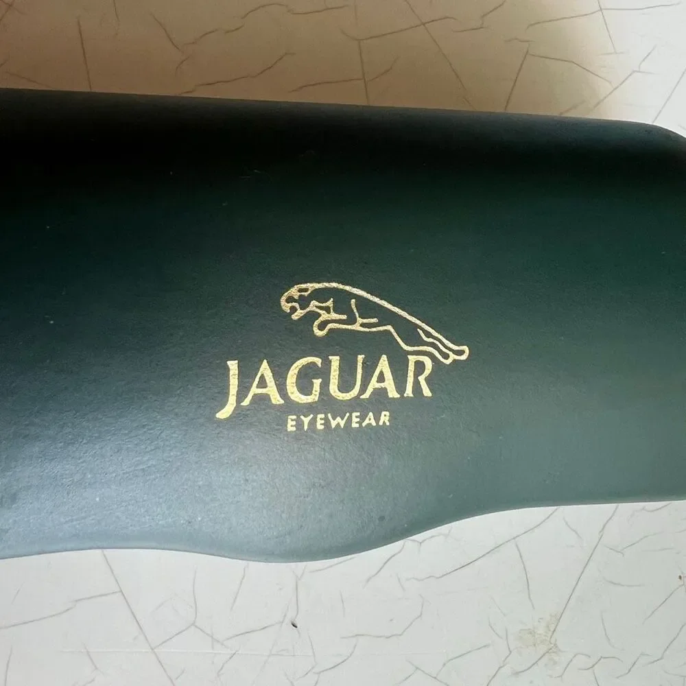 Jaguar dark green hard shell case for  eyeglasses or sunglasses.